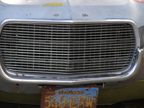 1973 Ford Ranchero - Front view of a 1973 Ford Ranchero showing its distinctive grille and a weathered license plate.