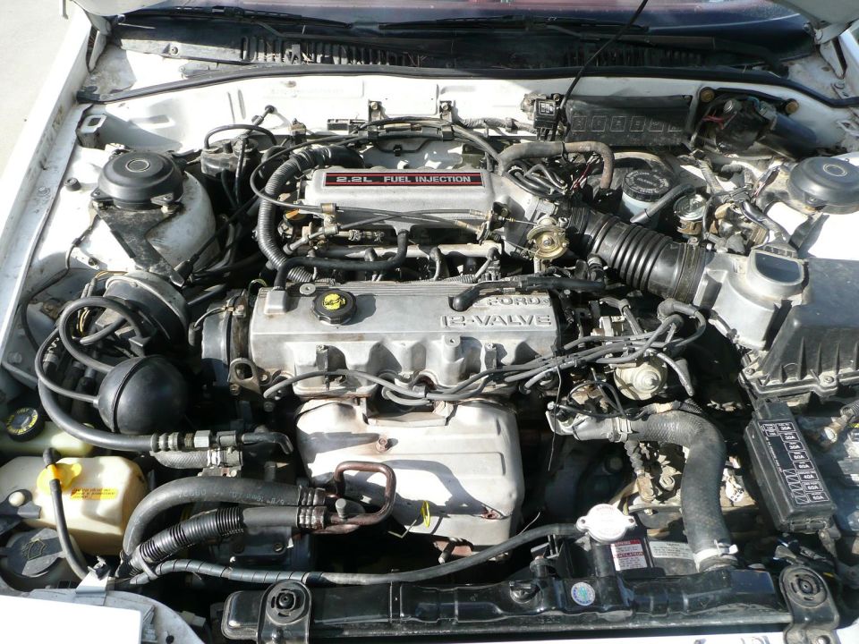 Inline four-cylinder fuel-injected engine bay close-up