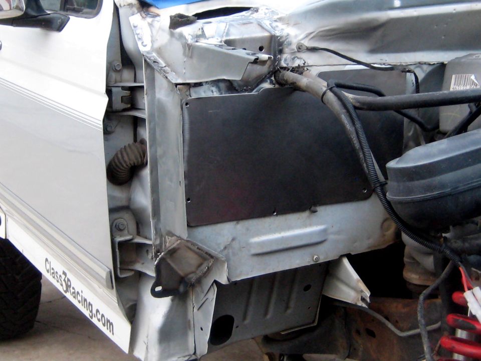 1996 Ford Bronco engine bay with exposed metal and wiring
