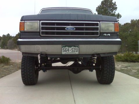 1990 Ford Bronco - This lifted Ford truck displays a grille design consistent with the late 1980s model years.
