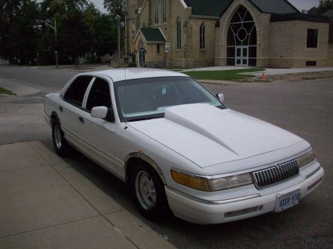 1992 Mercury Grand Marquis - This 1992 Mercury Grand Marquis has a custom hood that significantly alters its appearance.
