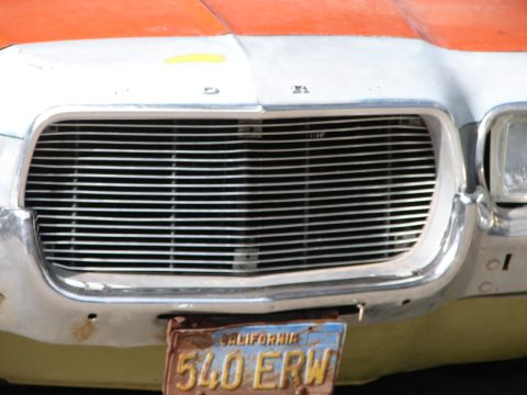 1973 Ford Ranchero - The horizontal grille bars and surrounding chrome bumper are visible on this classic Ford Ranchero.