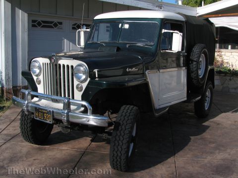1968 Ford Mustang - A vintage Jeep Willys Station Wagon is presented in a three-quarter front view, parked outdoors.