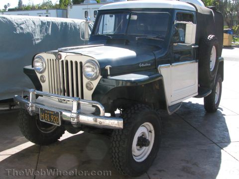 1968 Ford Mustang - This Jeep Willys, likely from the early 1950s, features a two-tone paint scheme and a spare tire mounted on the back.