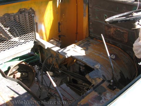 1968 Ford Mustang - Interior view of a vehicle undergoing restoration or disassembly, revealing its internal structure.