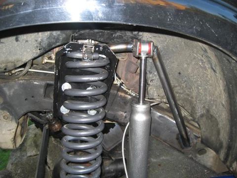 2004 Chevrolet Blazer - Custom suspension components are visible in this close-up view of a vehicle's wheel well.