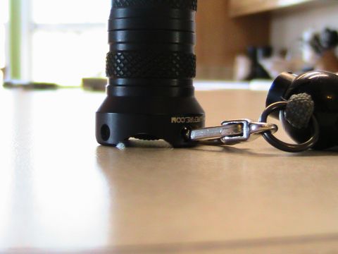 1984 Ford Bronco - Close-up of a flashlight and keychain on a countertop.
