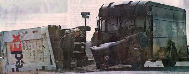 Newspaper photo of an overturned FedEx truck after a collision