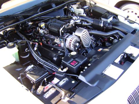 1996 Mercury Grand Marquis - Close-up view of a supercharged engine bay, showing the intricate details of the motor and its components.