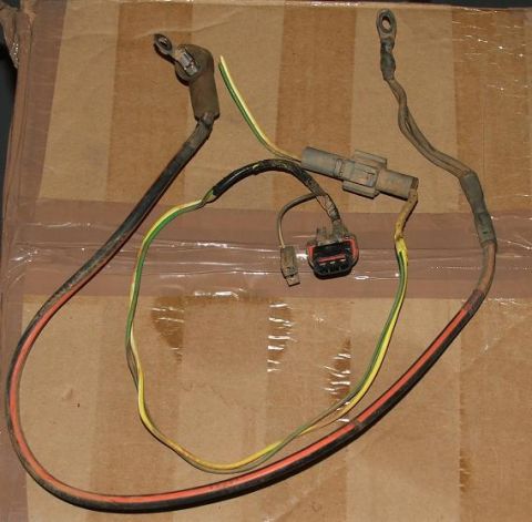 1985 Ford Crown Victoria LTD - Wiring harness with multiple connectors and eyelet terminals is laid out against a cardboard surface.