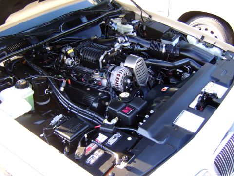 1996 Mercury Grand Marquis - A close-up view of a clean engine bay, showing various components and wiring.