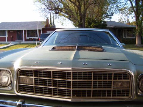 1973 Ford Ranchero - The front grille and hood scoop of a 1973 Ford Ranchero are visible in this close-up photo.