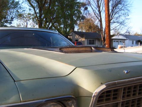 1973 Ford Ranchero - Front view of a 1973 Ford Ranchero's hood, showing an aftermarket scoop.