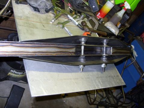 2008 Ford Bronco - A custom metal fabrication part is shown, likely for a vehicle modification or repair, with visible bolts and welding.