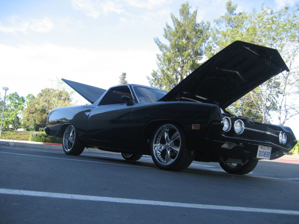 Black Ford Ranchero with hood up on polished billet wheels, California plate 7D CHERO