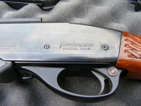 1979 Ford Bronco - A close-up view of the receiver and trigger assembly of a Remington Woodmaster Model 742 semi-automatic rifle.