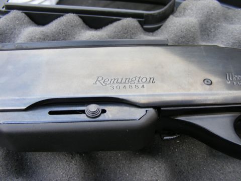 1979 Ford Bronco - A close-up shot of the receiver of a Remington 304884 shotgun, resting in a black foam-lined case.