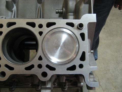 2007 Ford Mustang - Close-up photograph of an engine block cylinder bore and piston, not a technical document.