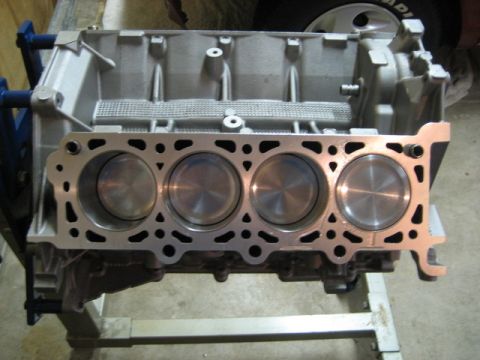2007 Ford Mustang - Photograph of an engine block deck with pistons, not a technical document.