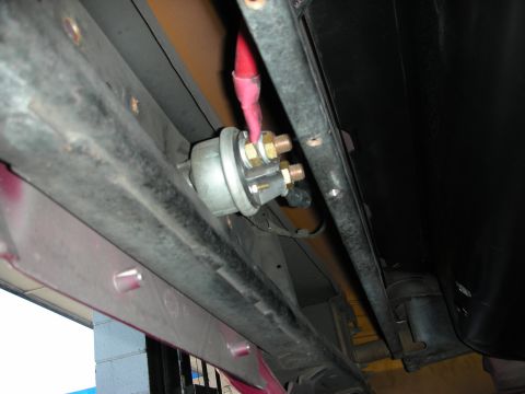 1992 Ford Crown Victoria - A close-up view of a car's undercarriage component, possibly related to the braking or suspension system.