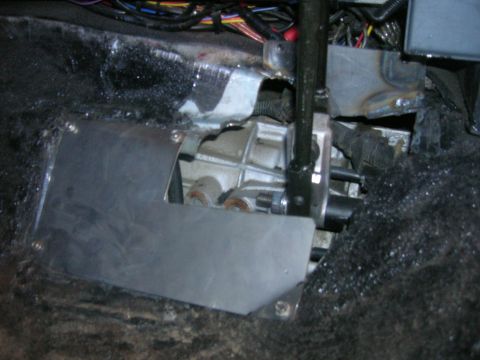 1996 Ford Bronco - Manual transmission shifter linkage and floor pan components are visible in this close-up view.