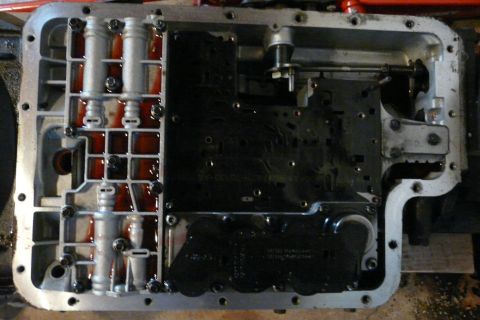 1995 Ford Bronco - The valve body removed. This trans has the 1st type VB. The Accumulator valve body is the piece to the left. When installing the Transgo re…