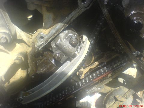 1992 Ford Crown Victoria - This image shows a close-up view of an engine's internal timing chain and tensioner system.