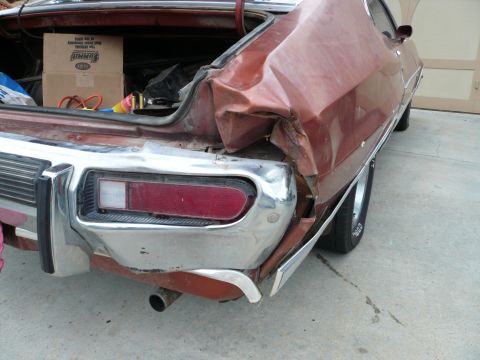 1975 Ford Ranchero - The rear of a 1975 Ford Ranchero shows extensive damage to the body and bumper.