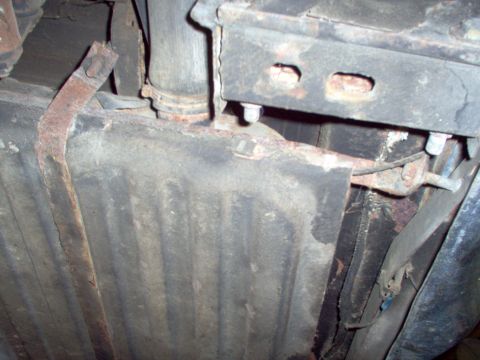 1970 Ford Ranchero - Close-up view of the undercarriage, focusing on the fuel tank and exhaust system.
