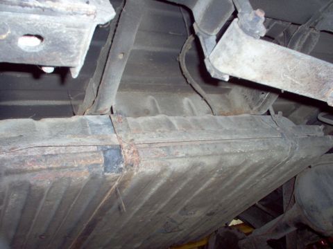 1970 Ford Ranchero - Underside view of a vehicle, focusing on the fuel tank and associated parts.