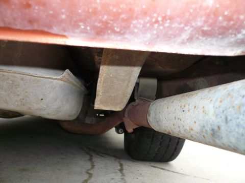 1975 Ford Ranchero - Underside view of a vehicle, revealing the exhaust system, fuel tank, and suspension components.