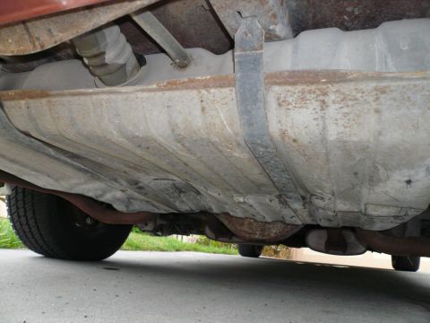 1975 Ford Ranchero - The underside of a vehicle, focusing on the fuel tank and suspension components.