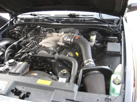 2003 Ford Crown Victoria - The engine bay of a Ford Crown Victoria, an aftermarket cold air intake system.