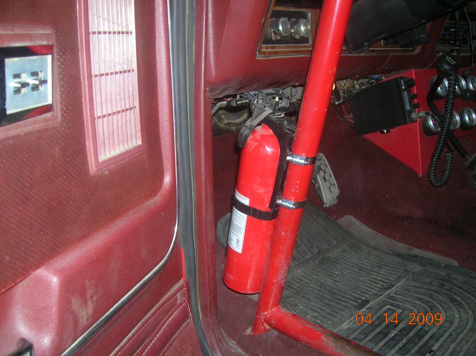 Red interior with a fire extinguisher mounted on the side