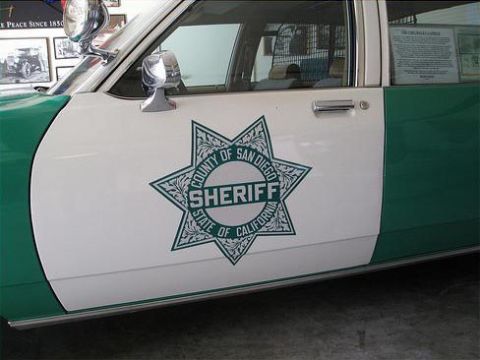 1991 Ford LTD Crown Victoria - A San Diego Sheriff's Department patrol car is shown with its distinctive star emblem on the door.