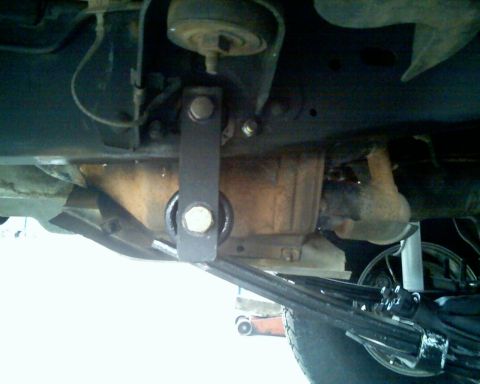 1996 Ford Bronco - Undercarriage view of a vehicle's suspension and drivetrain parts.