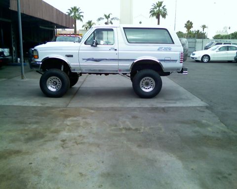 1996 Ford Bronco - This lifted 1990s Ford Bronco features custom wheels and a lifted suspension.
