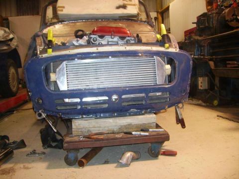 1969 MINI Cooper - Front end of a 1969 MINI Cooper undergoing modification with a large intercooler installed.