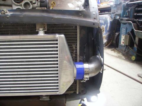1969 MINI Cooper - Close-up view of an intercooler and radiator, likely part of a custom engine modification.