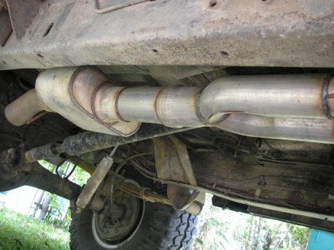 1979 Ford Bronco - Underside view of a vehicle's exhaust system, showing the muffler and pipes.