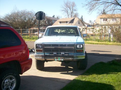 1982 Ford Bronco - This light blue pickup truck, likely from the early 1980s, is seen from the front with a prominent aftermarket bumper.