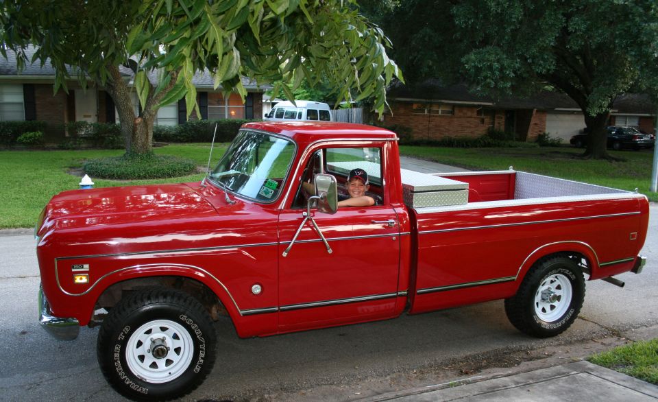 Red 1975 International Scout II pickup truck, 3q-front view