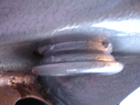 1995 Ford Taurus - A detailed view of a suspension part, likely a bushing or mount, showing its layered construction.