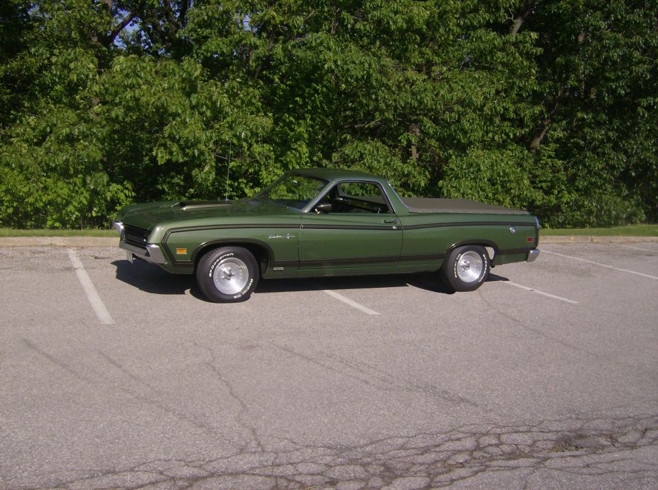 Green 1971 Ford Ranchero parked in a lot