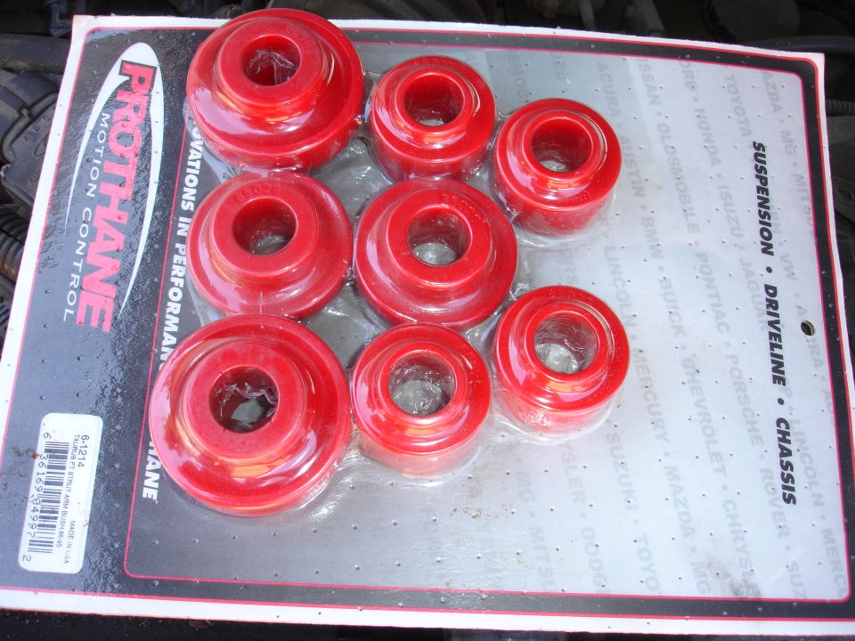 Photo of red Prothane polyurethane bushings on packaging card