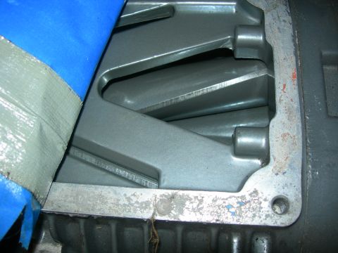 1984 Ford Bronco - A close-up view of the internal components of a supercharger, possibly from a 1984 Ford Bronco, with blue and gray tape partially covering…