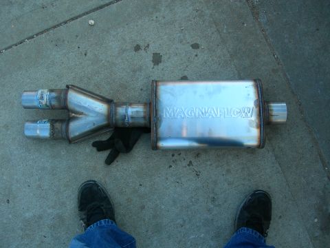 1984 Ford Bronco - Magnaflow exhaust muffler and Y-pipe shown on concrete ground.