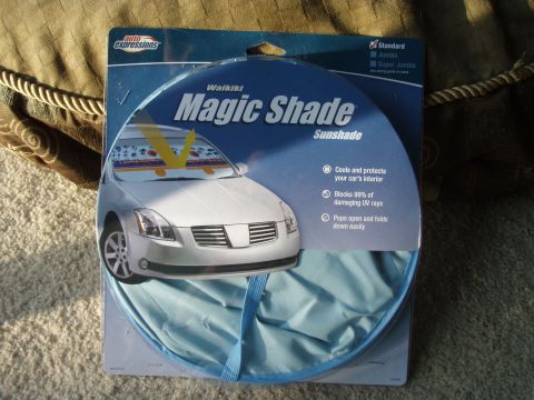 1994 Ford Bronco - A blue and white retail package for a Waikiki Magic Shade sunshade is displayed, featuring a graphic of a white sedan with the sunshade ins…