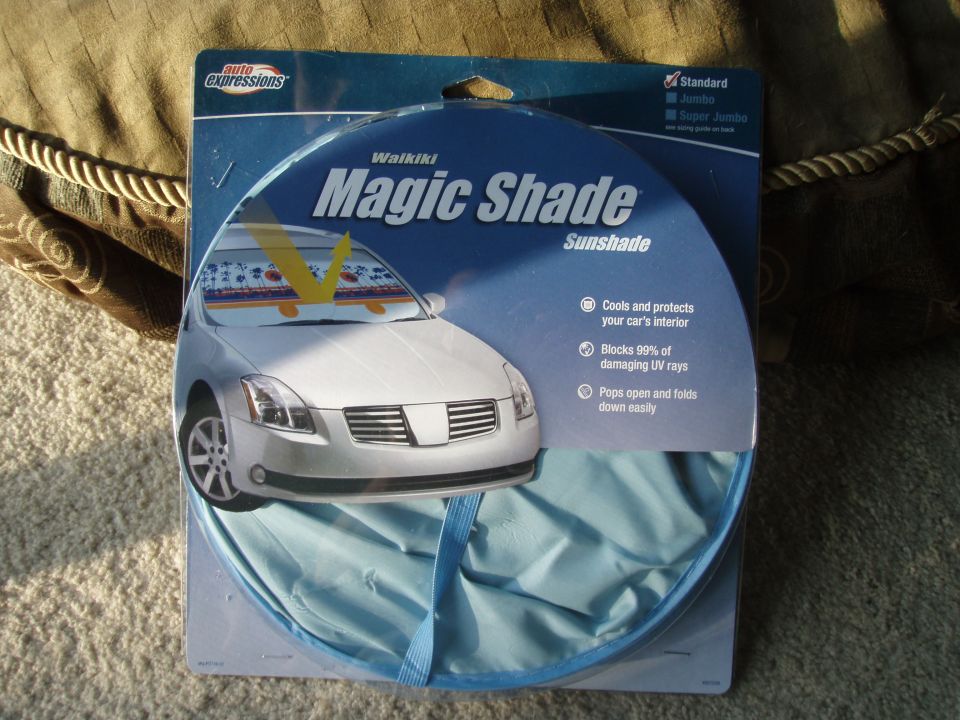 Retail package for Waikiki Magic Shade sunshade with graphic of a white car.
