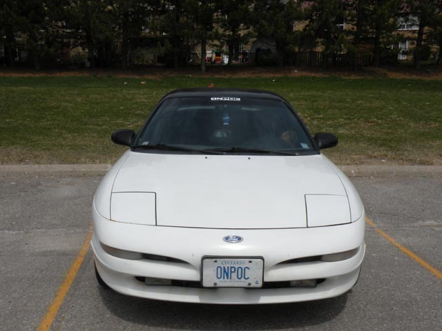 White 1995 Ford Probe with black roof, front view, Ontario license plate ONNPOC